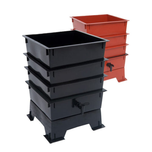 Photo of 2 Vermicomposting Bins, one black and one red plastic, each with 4 trays, pedestal, and front liquid drain