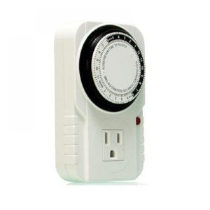 Photo of white, plastic timer with single AC outlet on front and round dial knobs to adjust settings