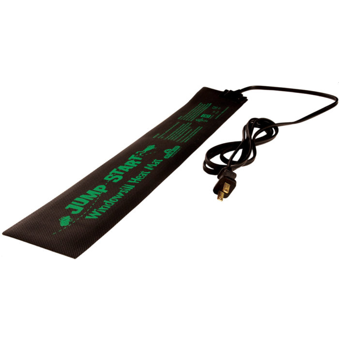 Photo of black rectangular heat mat with attached AC cord plug