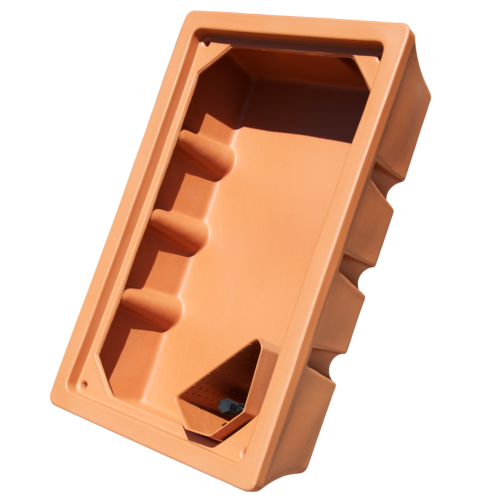 Photo of terracotta colored plastic molded media bed, rectangular shape, with a cut out media guard