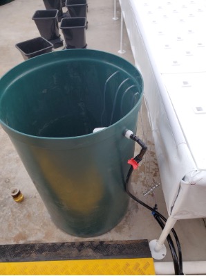 An example of a nutrient reservoir that receives water from the fish system in a one-directional flow.